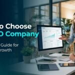 Business owner and SEO specialist reviewing website analytics to choose an SEO company.